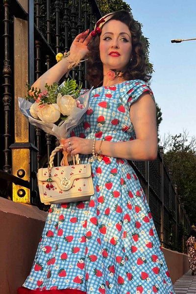 A model wearing Summer Strawberry Blue Gingham Dress