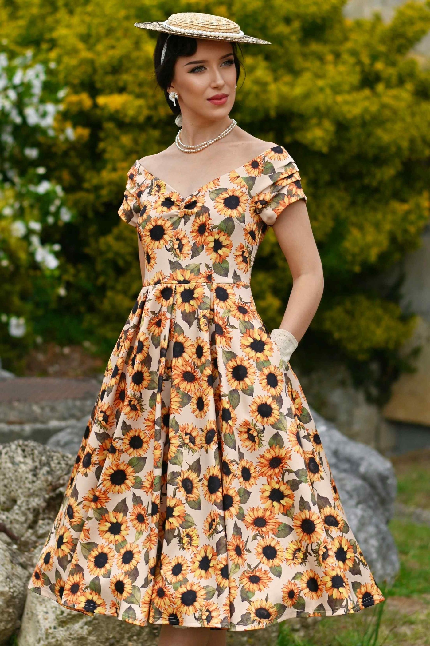 A lovely model wearing a Lily Sunflower Off Shoulder Dress