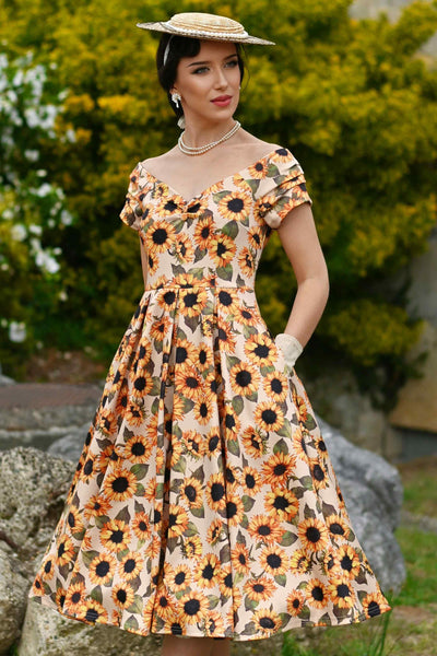 A lovely model wearing a Lily Sunflower Off Shoulder Dress