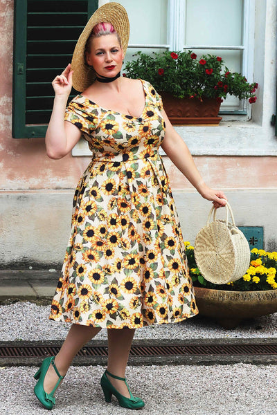 A model wearing a Lily Sunflower Off Shoulder Dress
