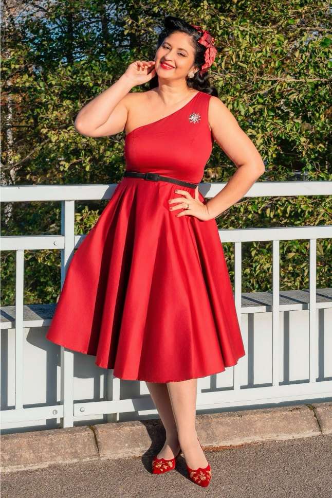 A model wearing a Susan One Shoulder Red Blue Swing Dress