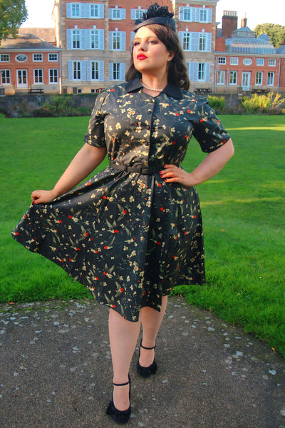 A Model photo of Swallow Floral Shirt Dress