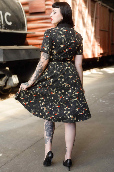 Back view of model wearing Swallow Floral Shirt Dress