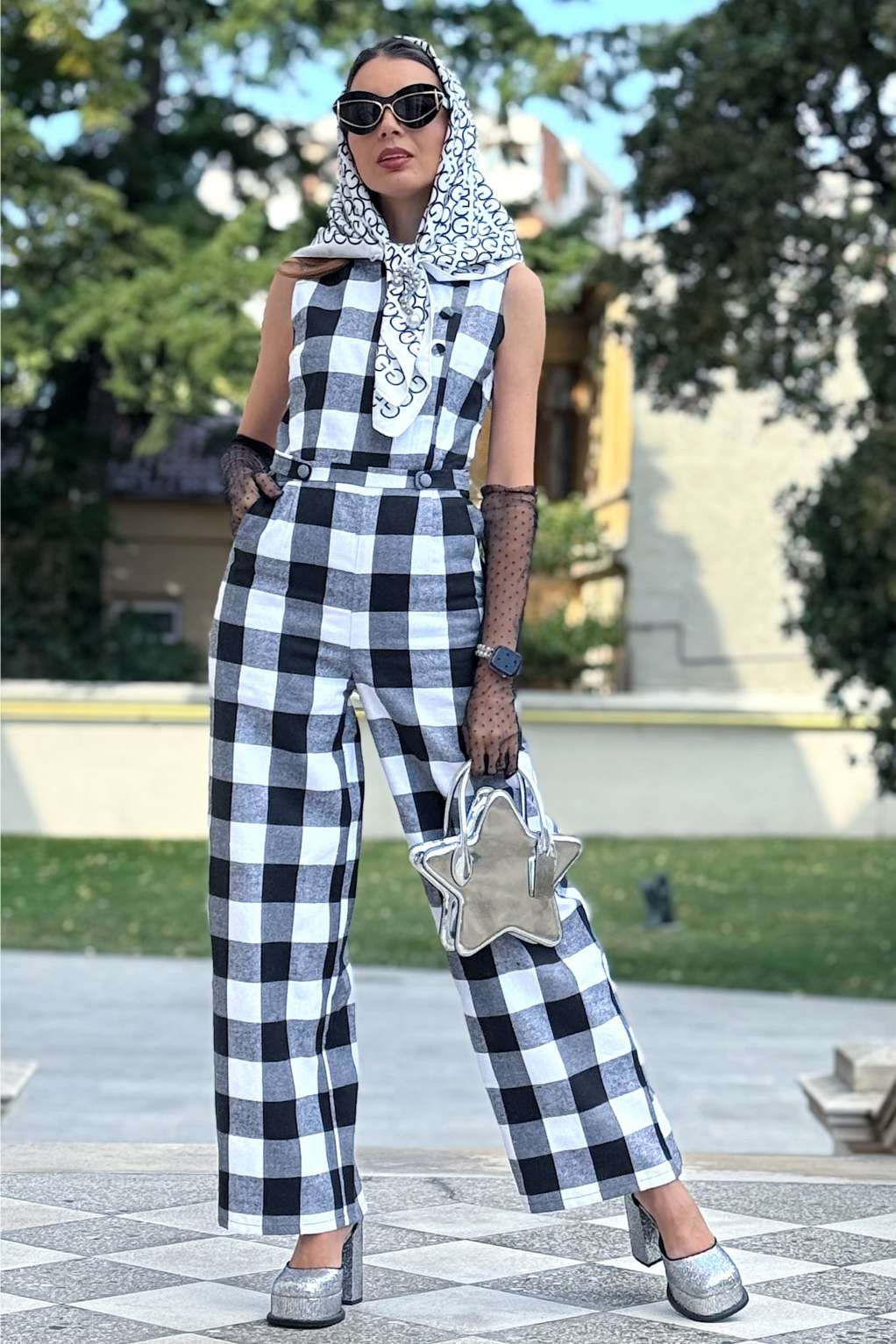 A model wearing a Sylvia Monochrome Check Jumpsuit