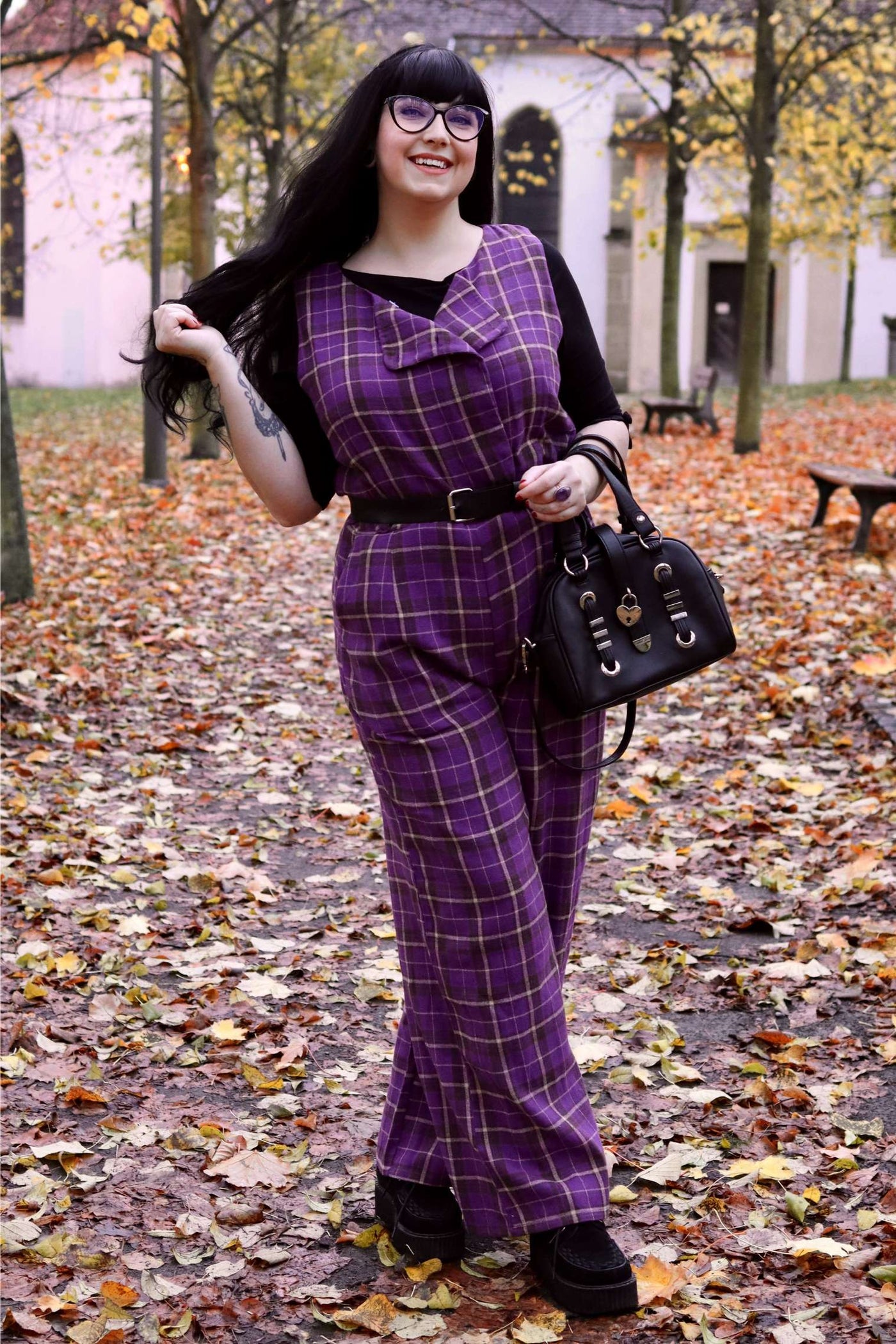 A lovely model wearing a Sylvia Purple Tartan Jumpsuit