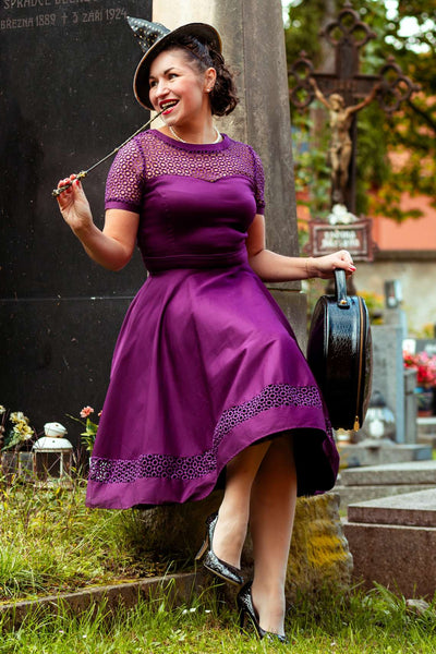 A graceful model wearing a Tess Crochet Lace Formal Dress In Purple
