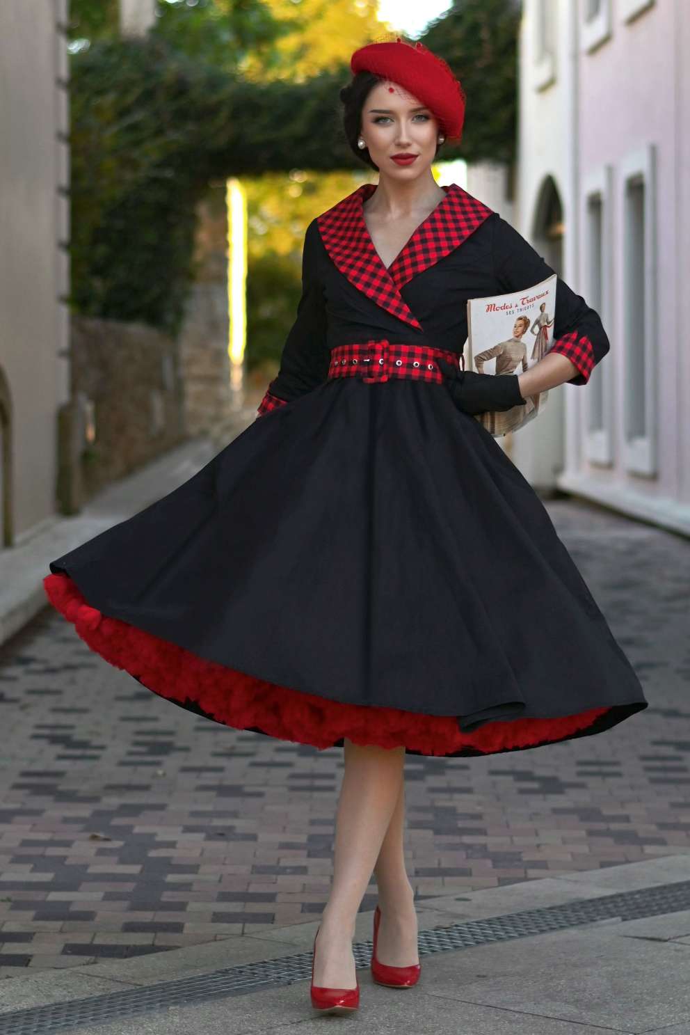 A charming model wearing a Tiffany Black Coat Dress With Red Check