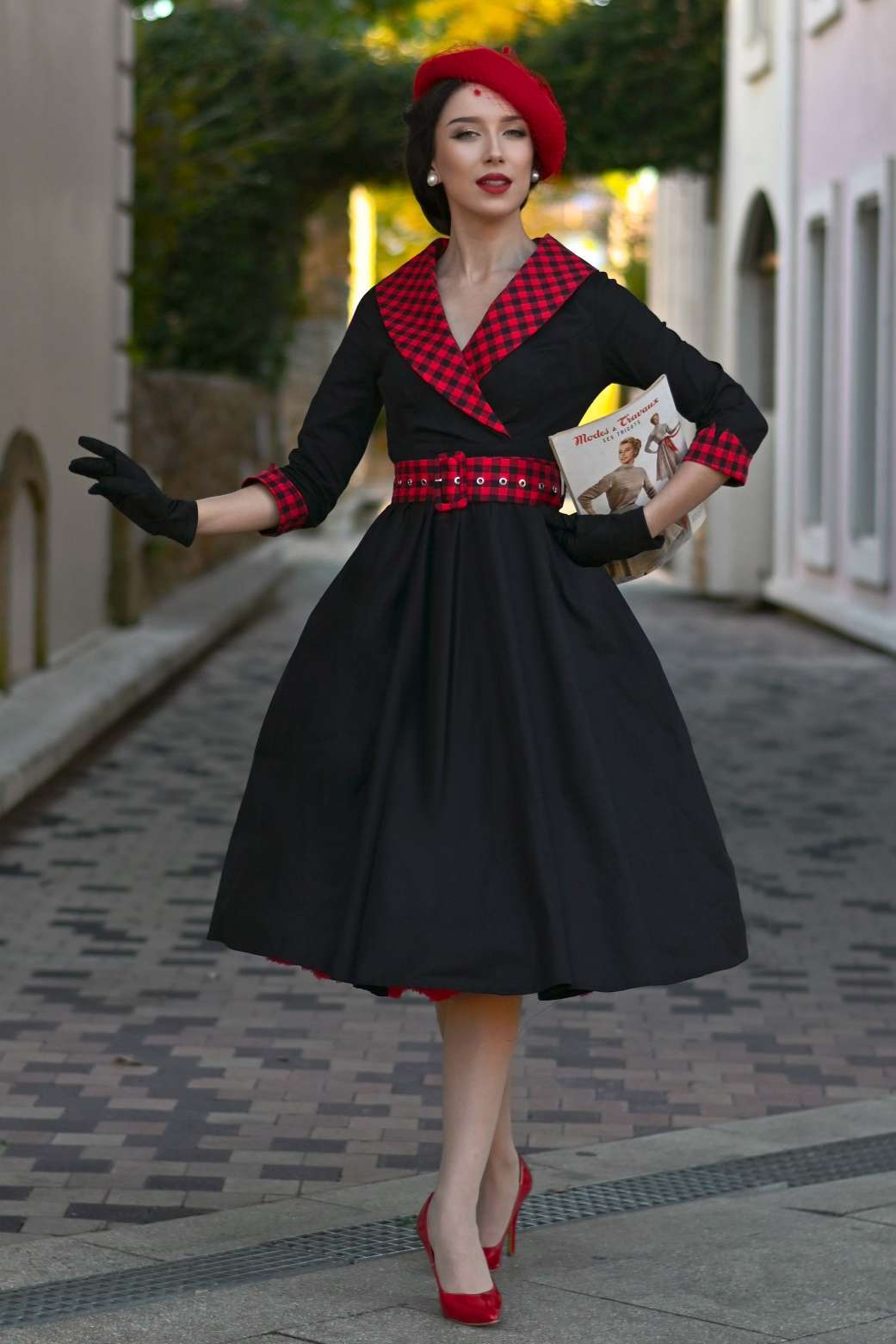 A graceful model wearing a Tiffany Black Coat Dress With Red Check