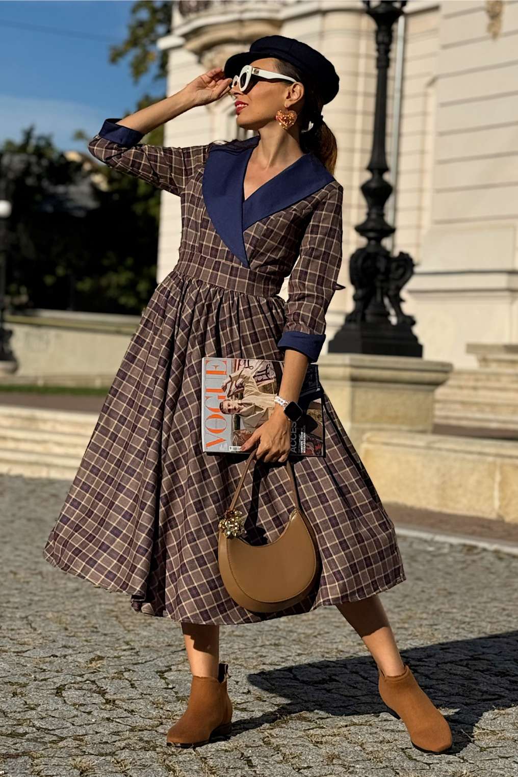 A model wearing a Tiffany Navy Tartan Coat Dress