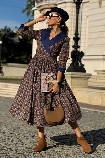 A model wearing a Tiffany Navy Tartan Coat Dress