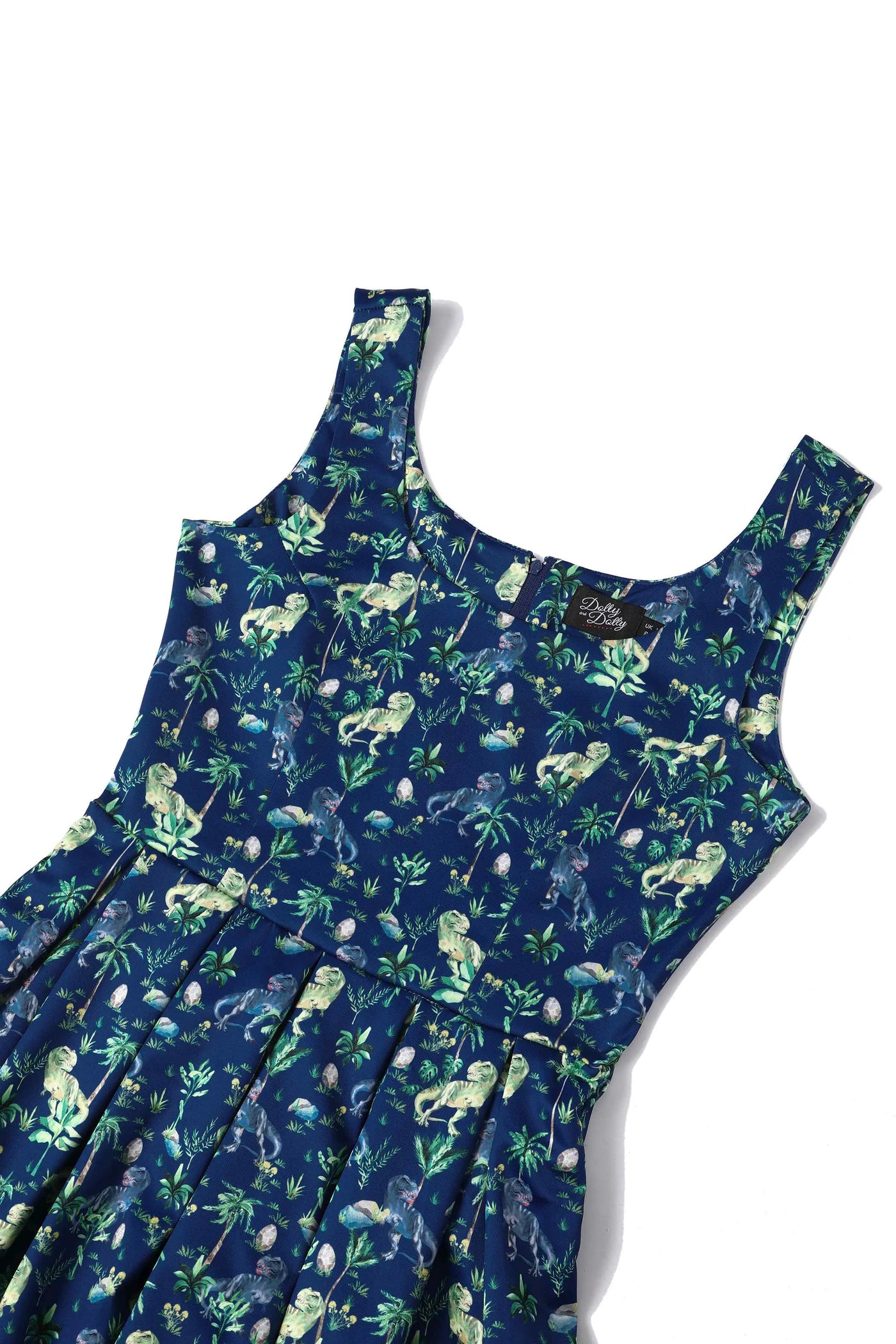 T-rex dinosaur print dress in navy blue, lying down