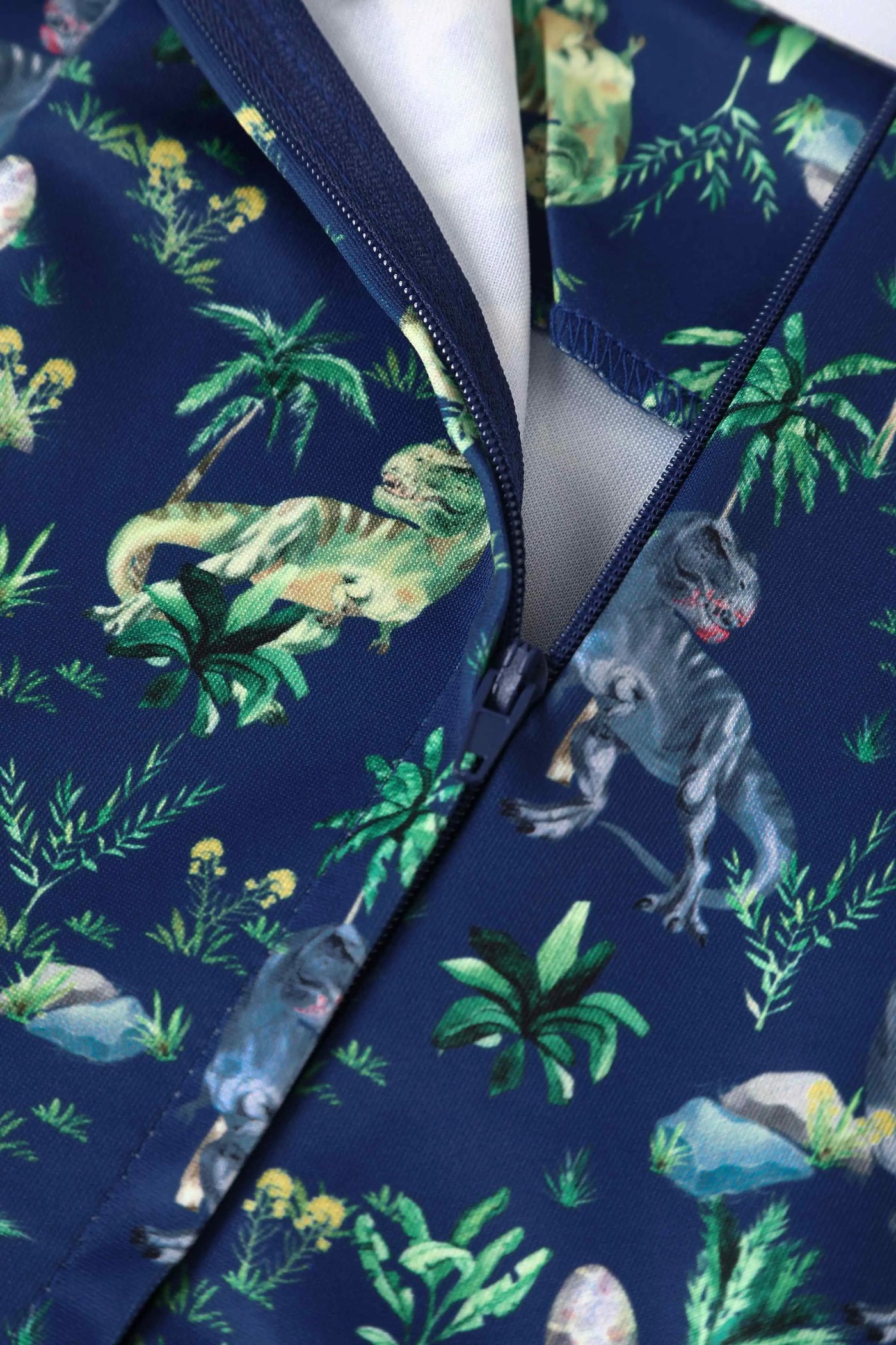 T-rex dinosaur print dress in navy blue zip close up
