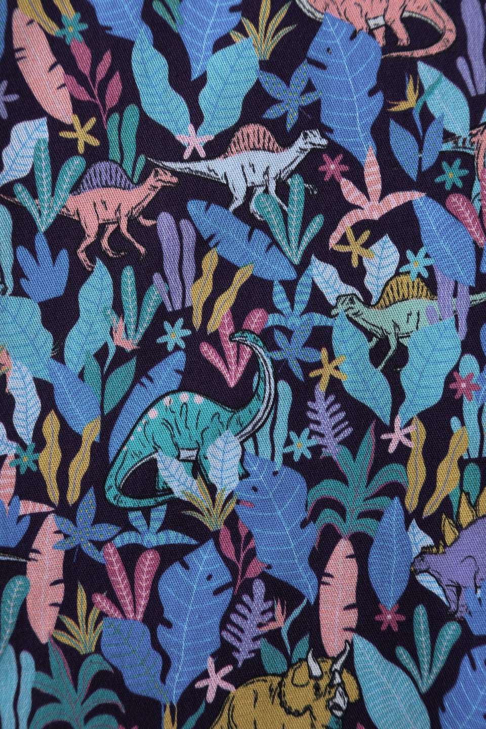 Close up view of Dinosaur Shirt Dress in Navy Blue