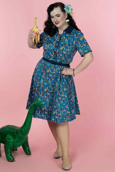 A model wearing a Dinosaur Shirt Dress in Navy Blue
