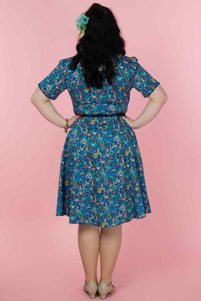 A model wearing a Dinosaur Shirt Dress in Navy Blue