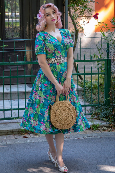 A lady wearing a Tropical Cheetah Midi Dress