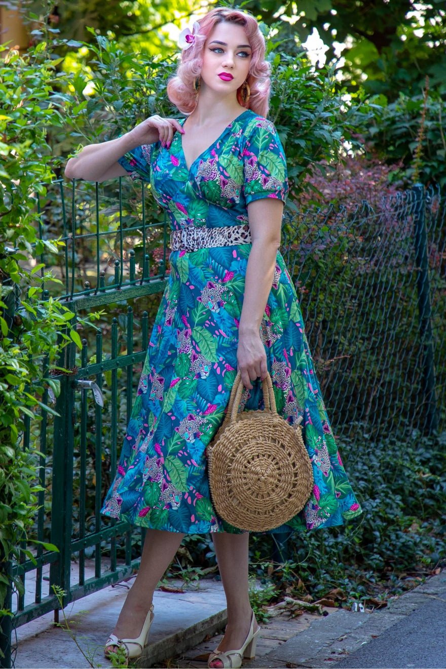A lady wearing a Tropical Cheetah Midi Dress
