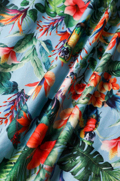 Close up view of Tropical Parrot Hibiscus Day Dress in Baby Blue