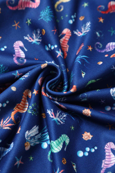 Close up view of Underwater Seahorse Print Flared Dress in Navy Blue