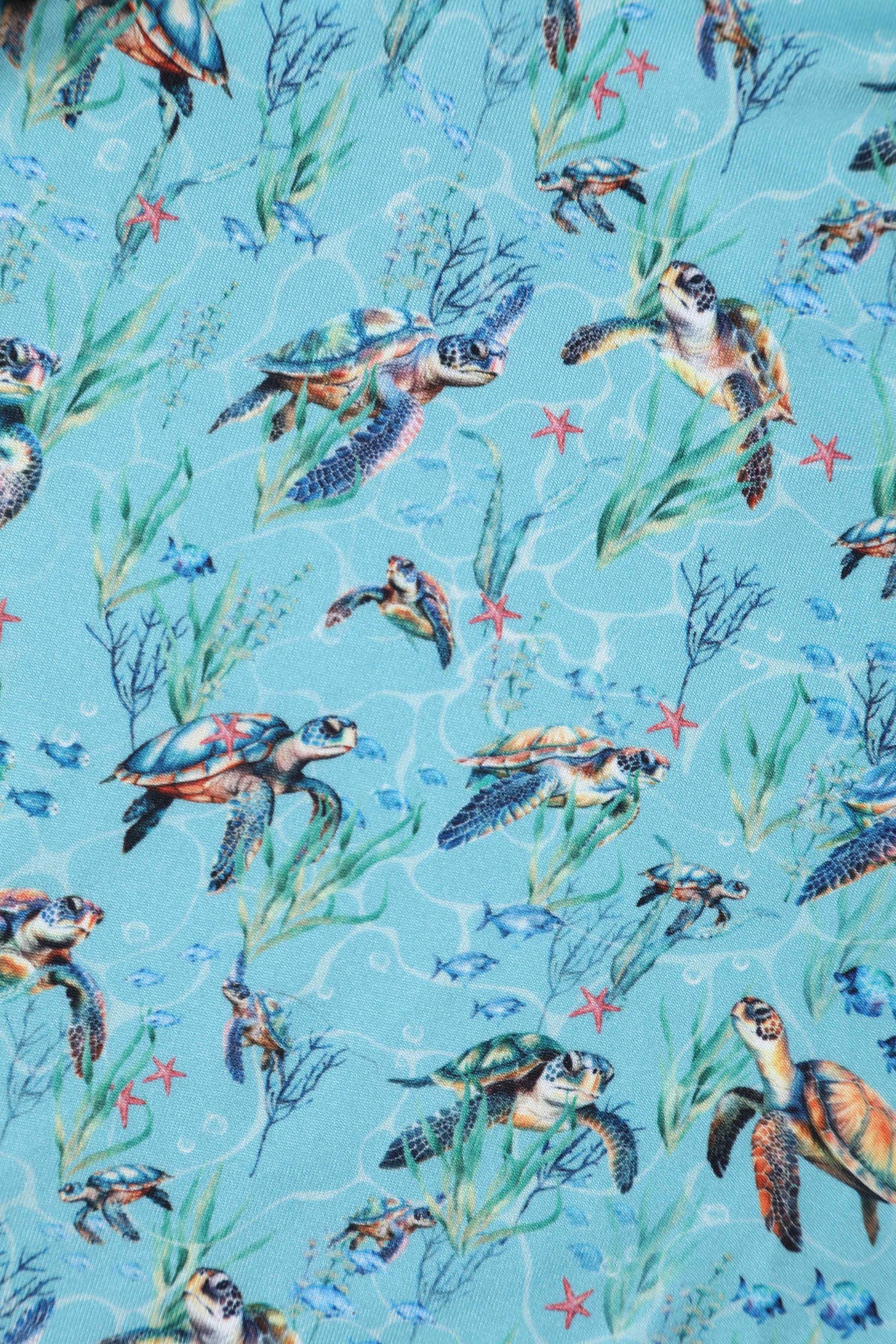 Close up view of Underwater Turtle Print Flared Dress in Light Blue