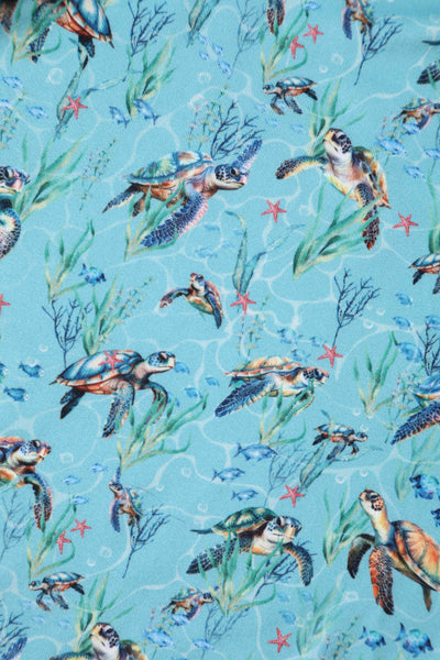 Close up view of Underwater Turtle Print Flared Dress in Light Blue