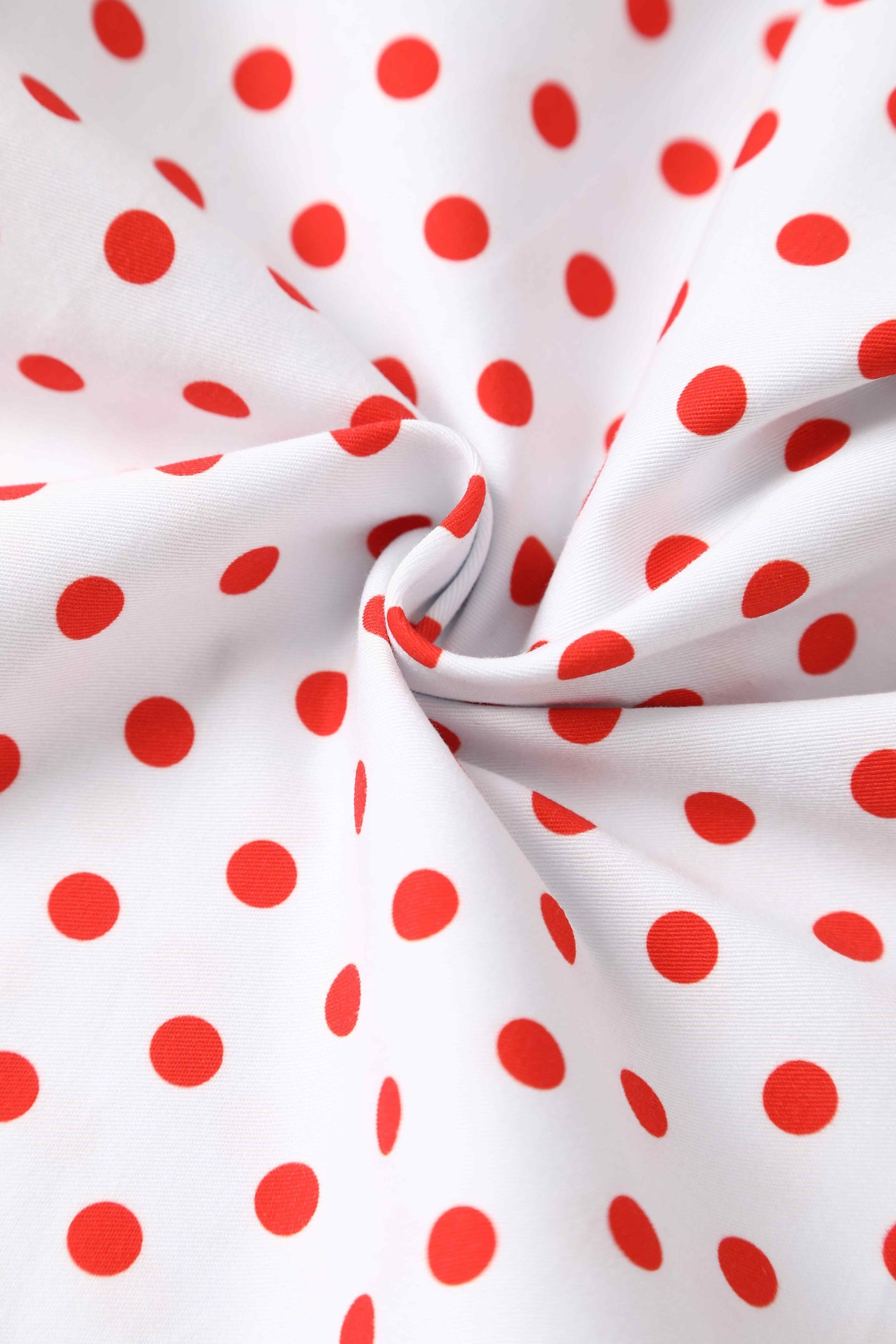 Close up view of V Neck White and Red Polka Dot Dress
