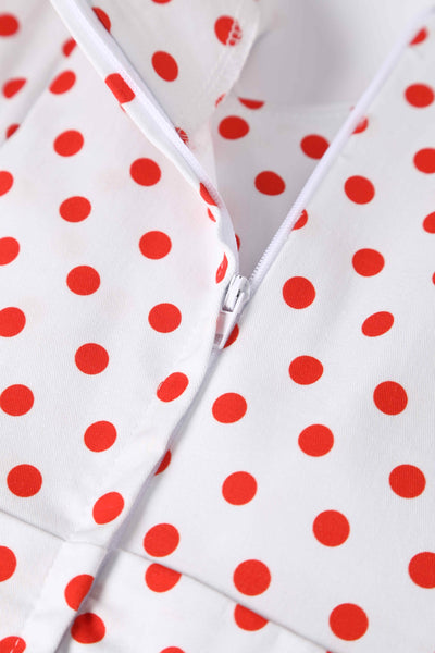 Close up view of V Neck White and Red Polka Dot Dress