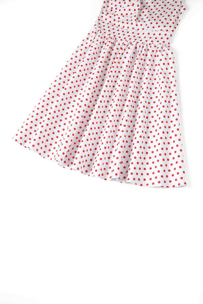 Close up view of V Neck White and Red Polka Dot Dress