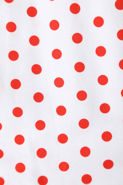 Close up view of V Neck White and Red Polka Dot Dress
