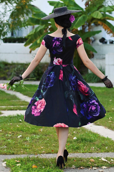 A lovely model wearing a Lily Peony Garden Off Shoulder Dress