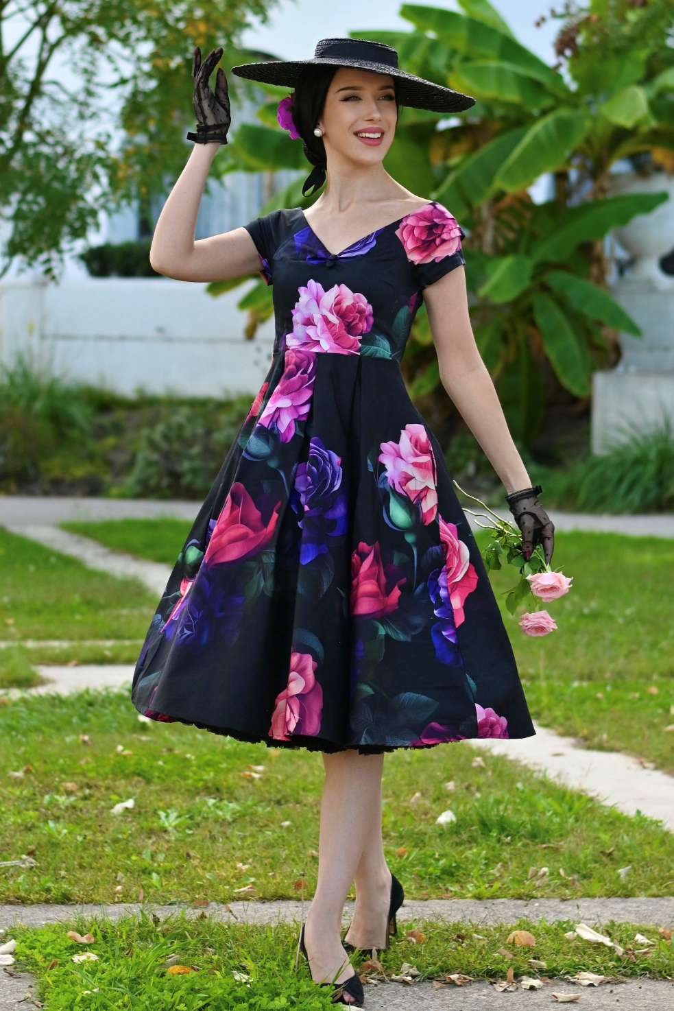 A model wearing a Lily Peony Garden Off Shoulder Dress