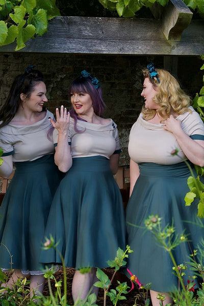 Ladies wearing the Darlene Retro Beige/Dark Green Swing Dress