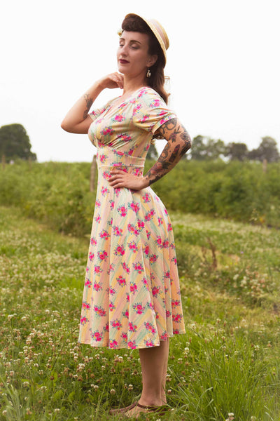 A lady wearing a Julia Vintage Pastel Floral Midi Dress