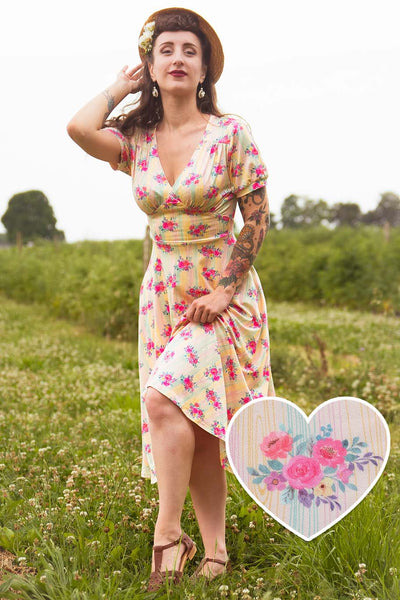 A woman in a Julia Vintage Pastel Floral Midi Dress