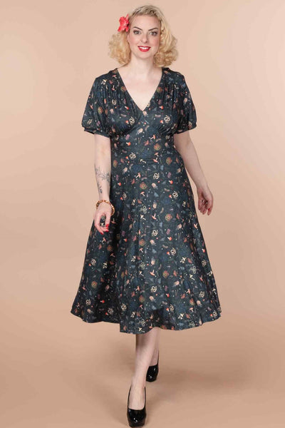 A model wearing a 50s Style Mystical Forest Dress
