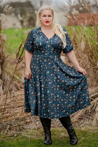 A model wearing a 50s Style Mystical Forest Dress