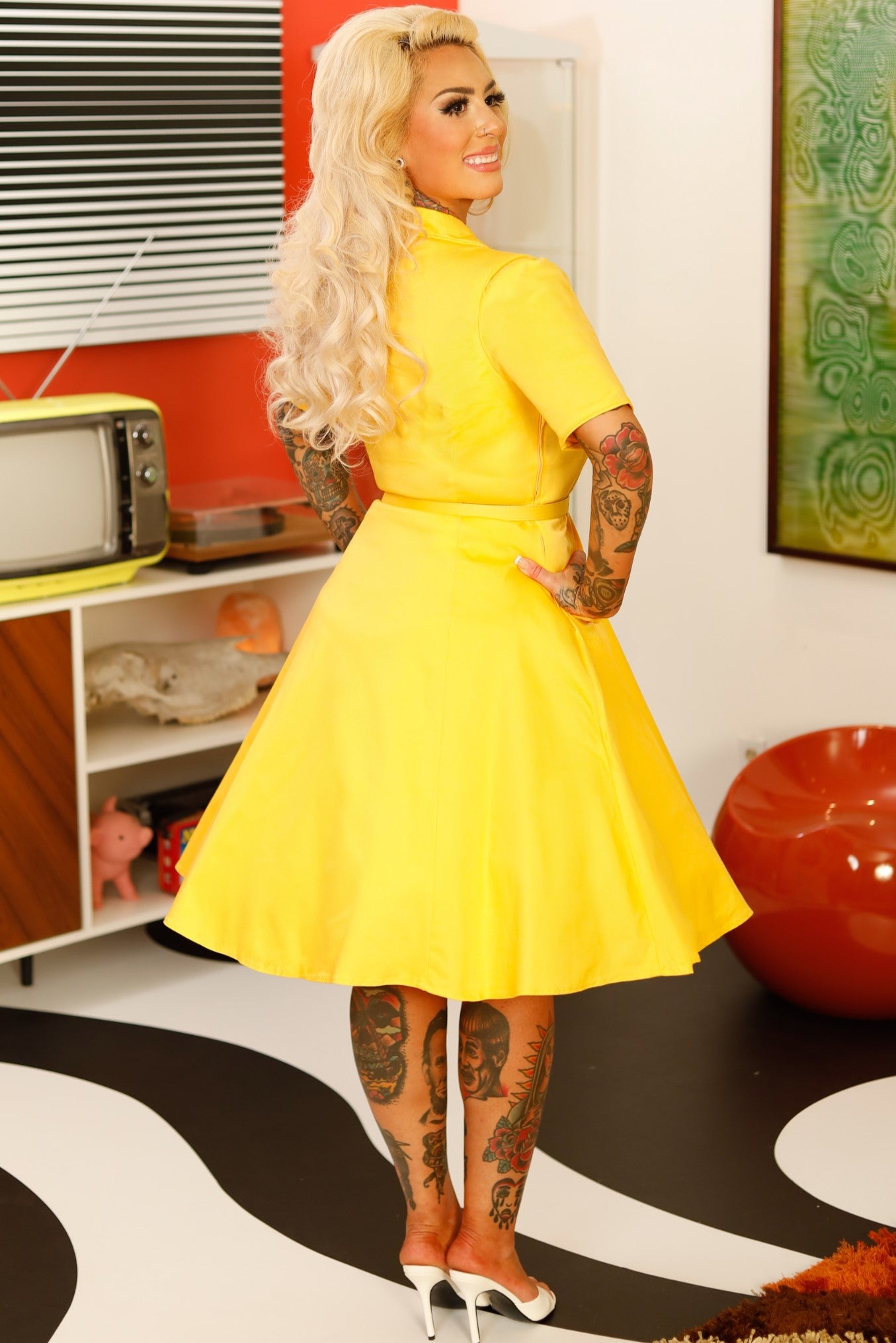 A lady wearing a Vintage Yellow Shirt Dress