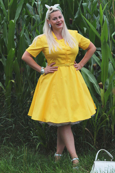 A lady wearing a Vintage Yellow Shirt Dress
