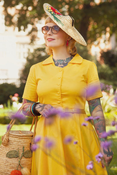 A lady wearing a Vintage Yellow Shirt Dress