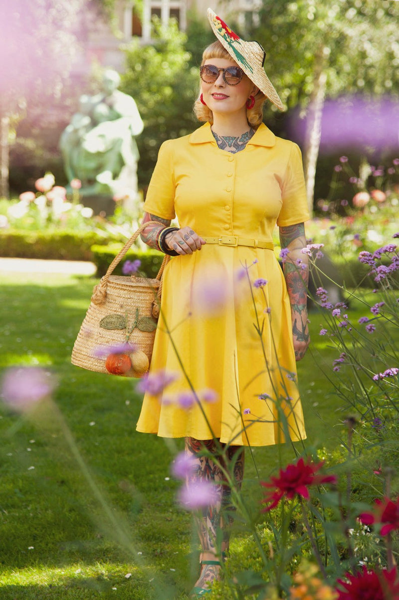 A lady wearing a Vintage Yellow Shirt Dress