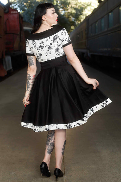 Back view of model wearing White & Black Floral Roll Collar Dress