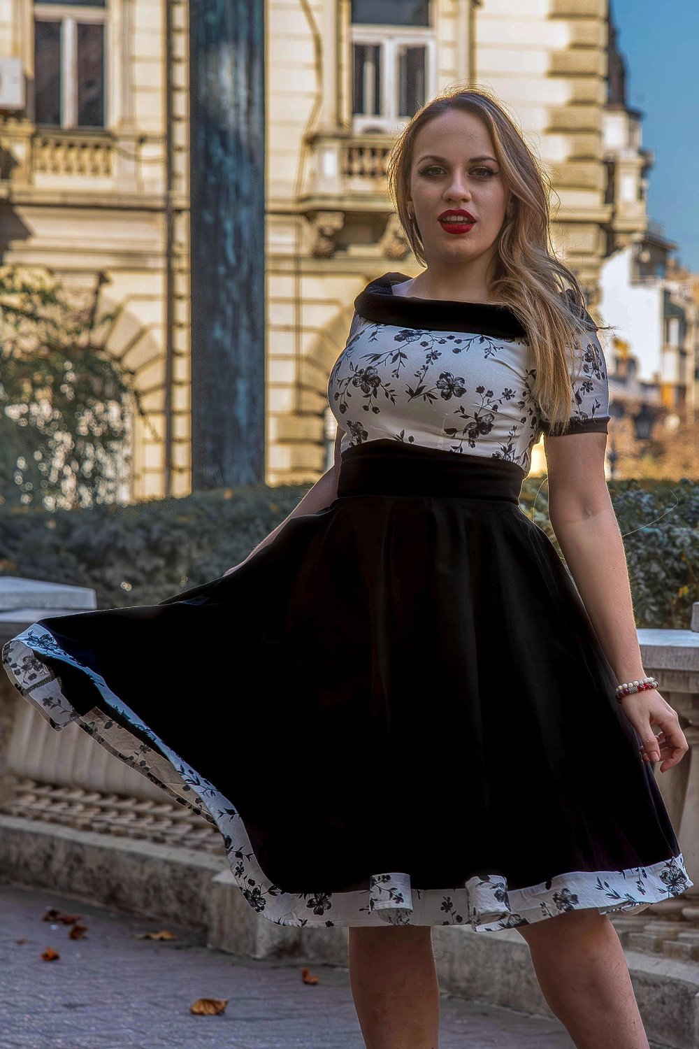 A model wearing a White & Black Floral Roll Collar Dress