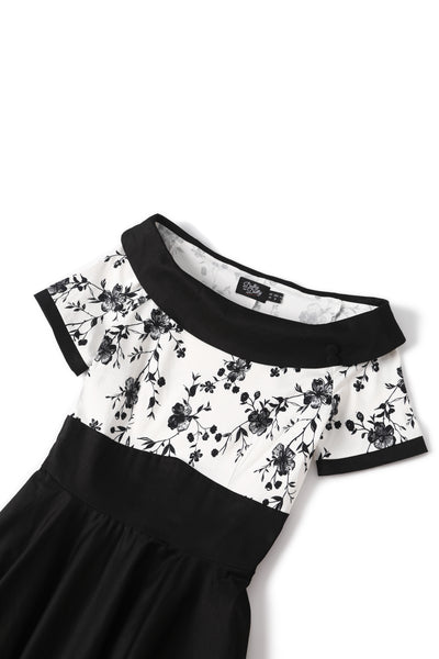 Close up  view of White & Black Floral Roll Collar Dress