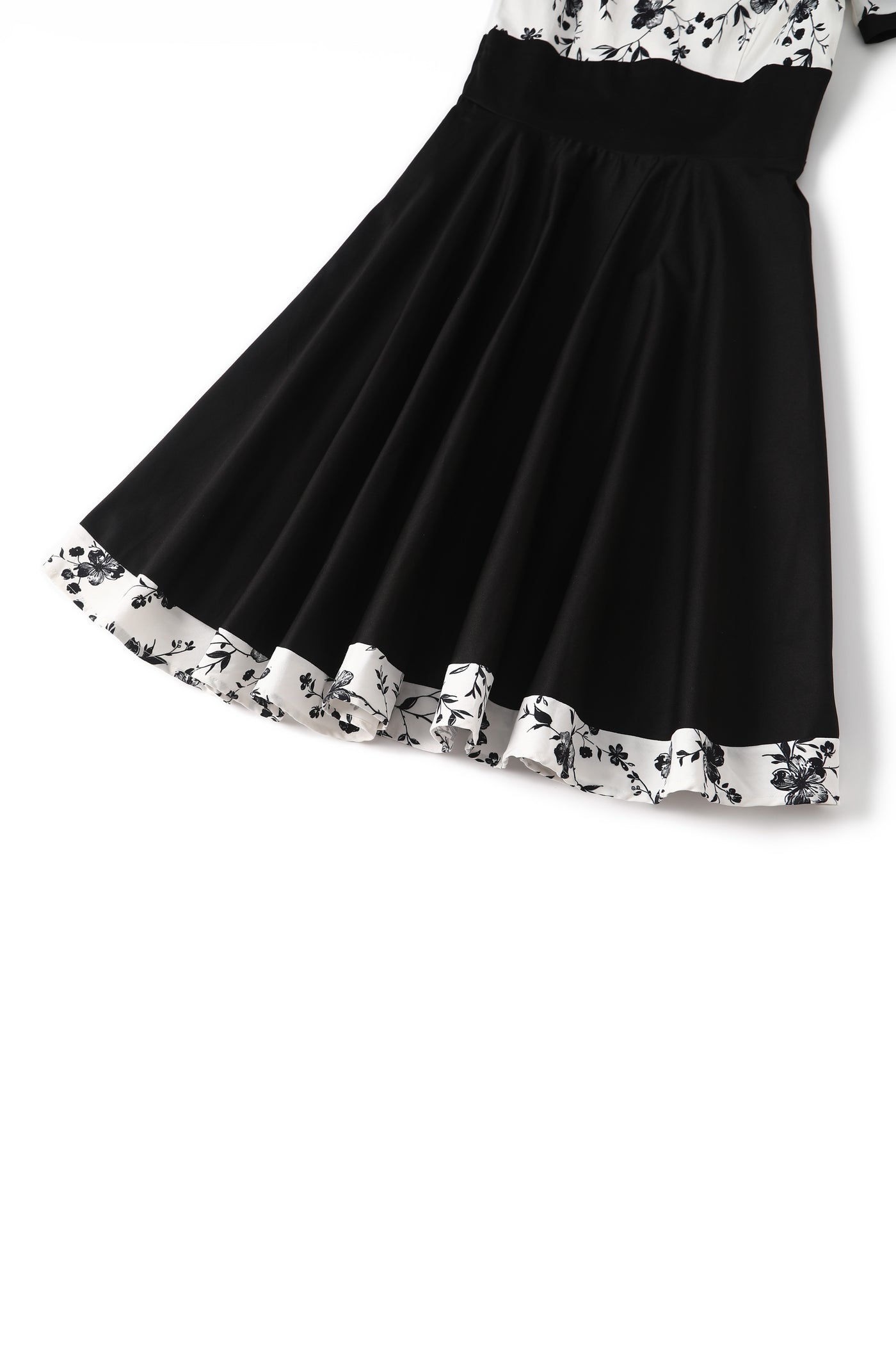 Close up  view of White & Black Floral Roll Collar Dress