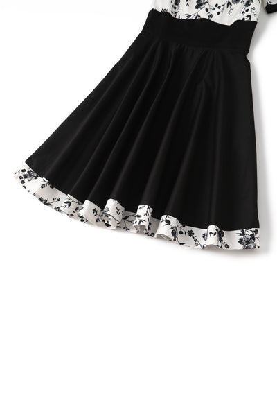 Close up  view of White & Black Floral Roll Collar Dress