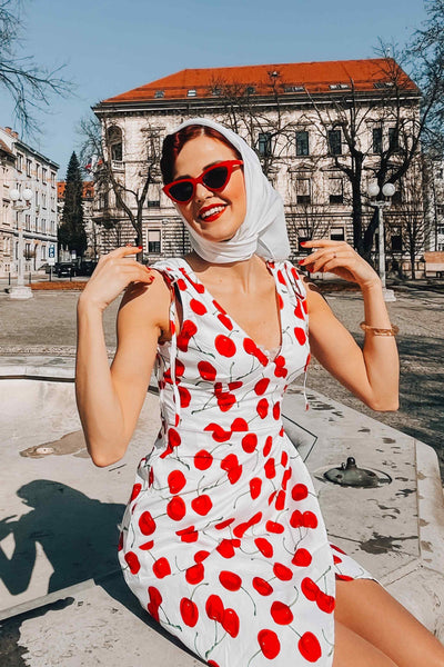 A model wearing White Cherry Wiggle Dress