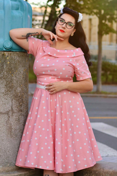 A model wearing a White Polka Dot Dress In Baby Pink