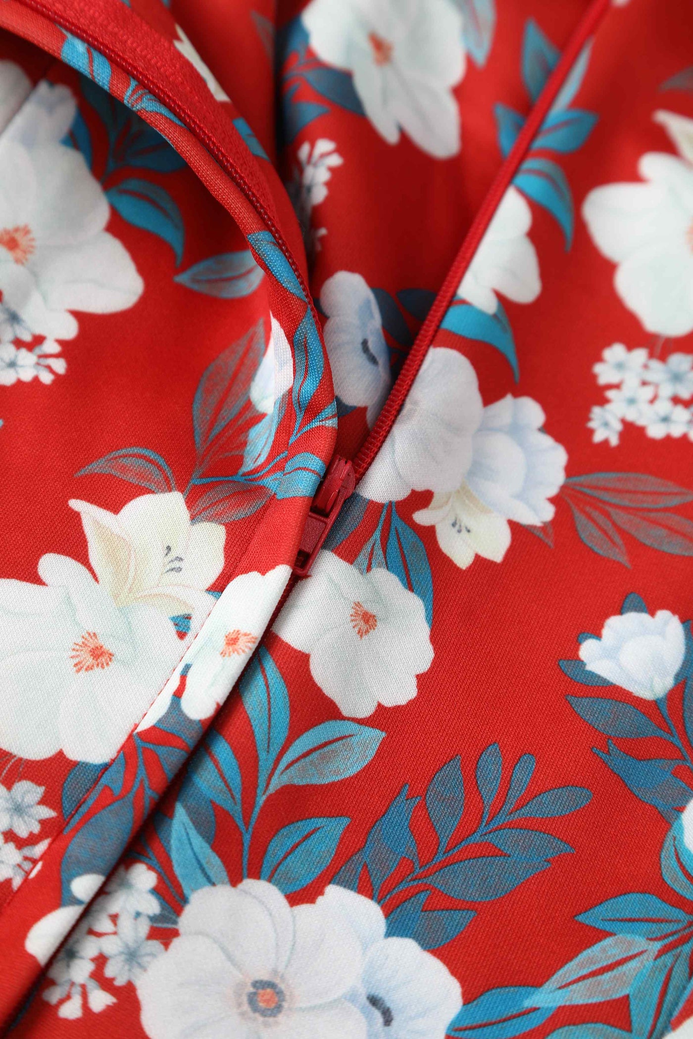 Close up view of White Rose Off Shoulder Dress In Red