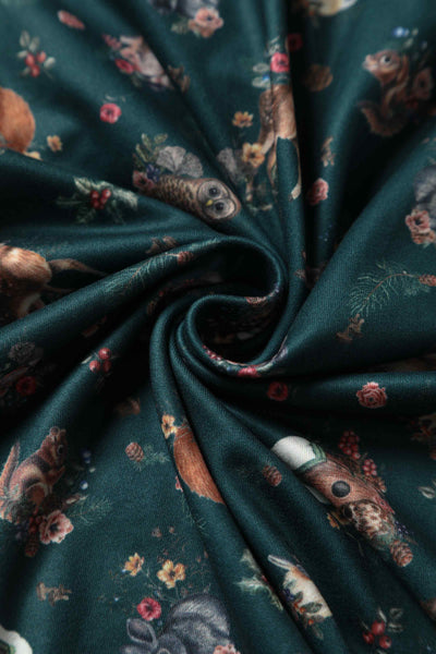 Close up view of view of Woodland Deer and Owl Dress in Green