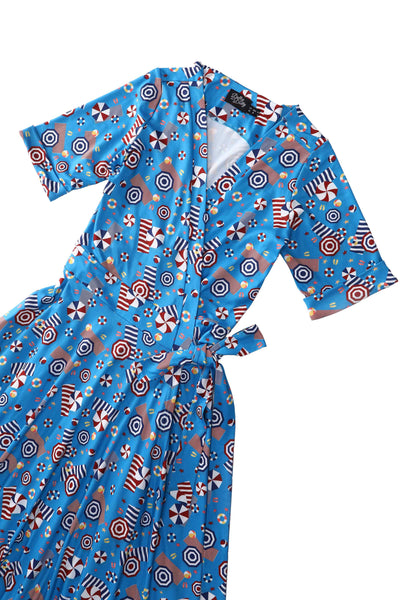 Close up view of the top of Matilda Wrap Dress In Blue Parasole Print